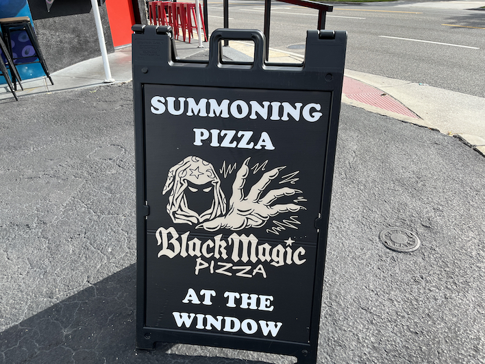Black Magic Pizza sign